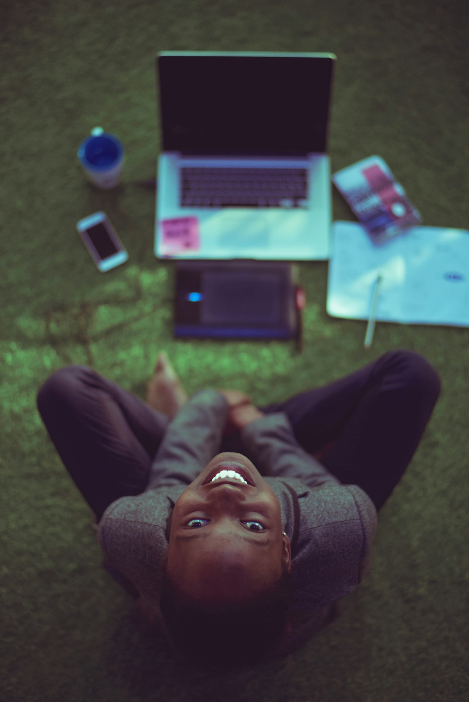 Nigerian student weighing course options with laptop and notebooks for JAMB 2026 decision
