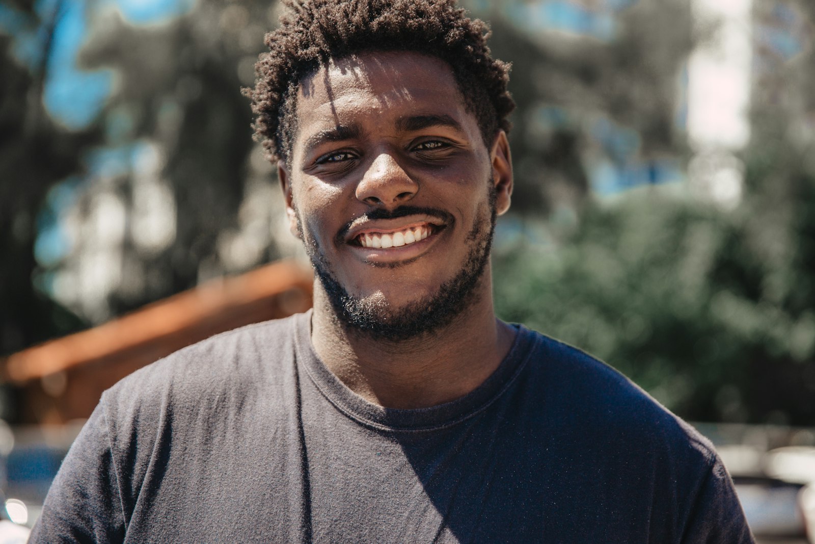 African university student smiling, on AI detection in universities in 2026