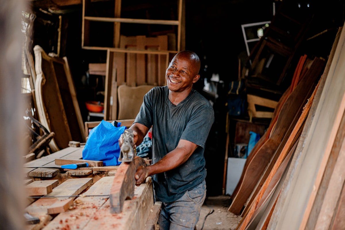 African carpenter showing a practical TVET skill in a workshop