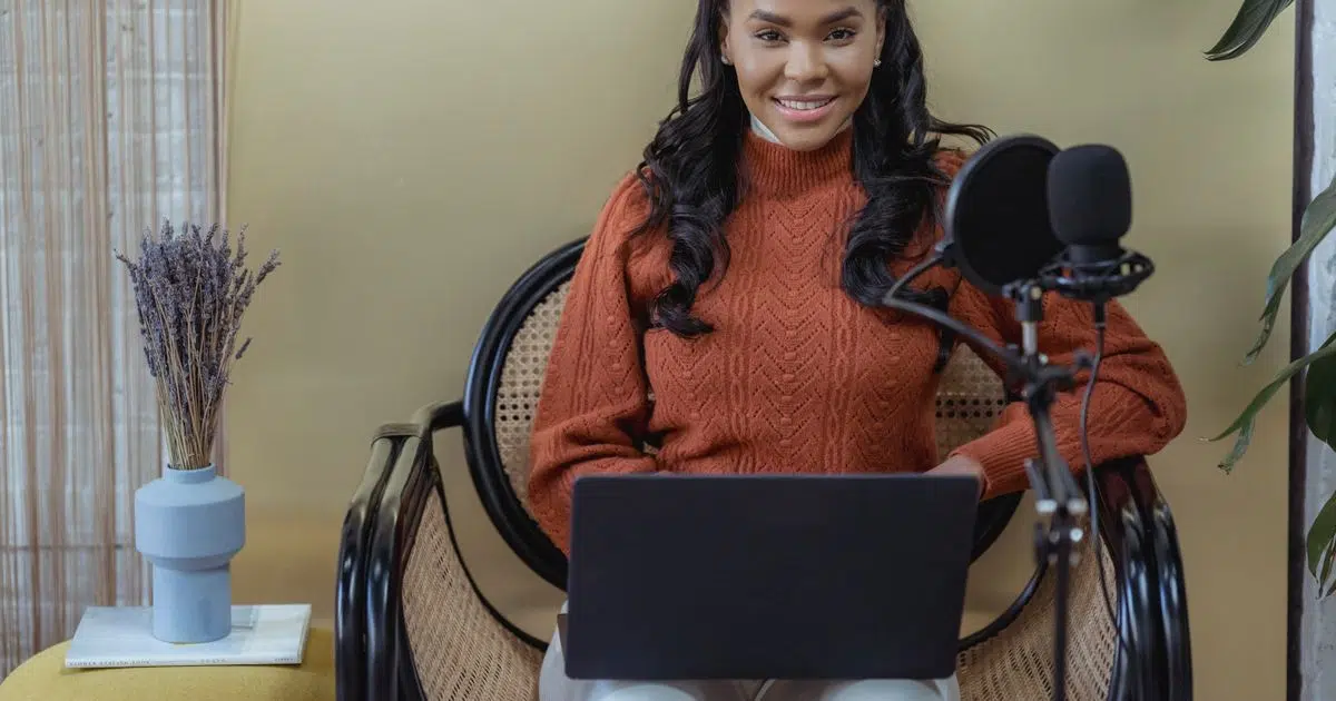 Young Nigerian woman earning online on a laptop from home