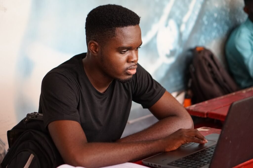 Nigerian student checking his WAEC result 2026 on a laptop