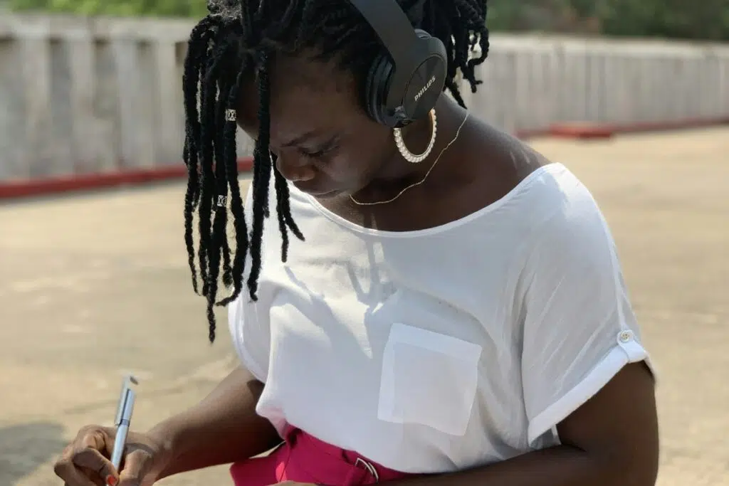 Young Nigerian student writing her SIWES report