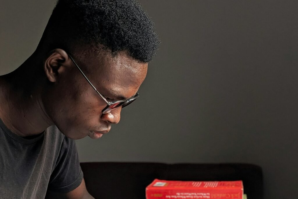 Nigerian university student reading his notes