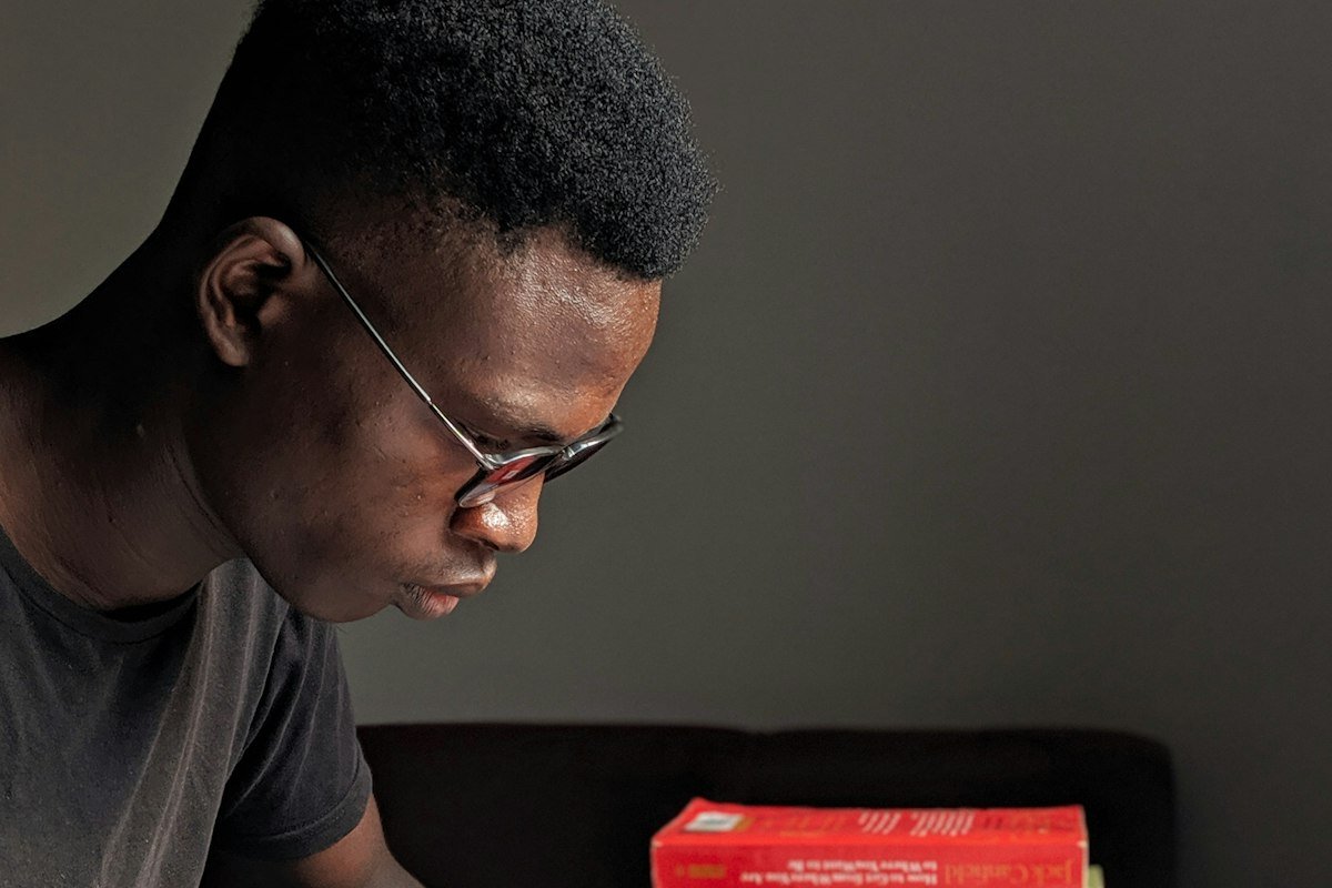 Nigerian university student reading his notes